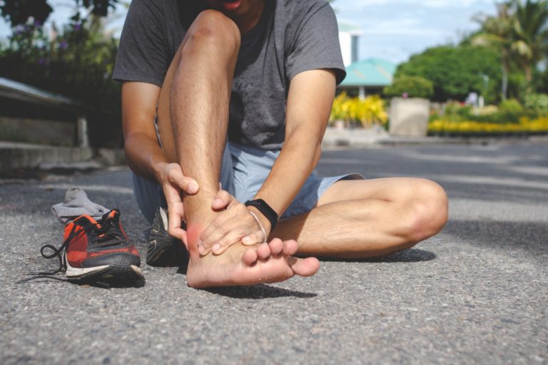 Chiropractor treating an ankle sprain for a patient in Wilmington NC